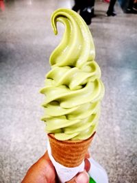 Close-up of hand holding ice cream