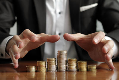 Cropped image of hand holding candles