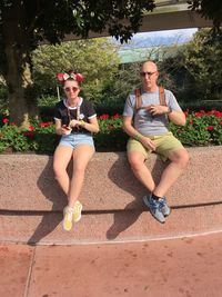 Young couple sitting on plant