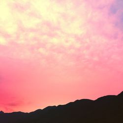 Silhouette mountains against sky during sunset