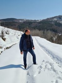 Scenic view of snow covered landscape against sky