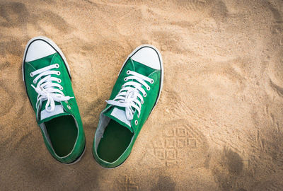 High angle view of shoes on sand