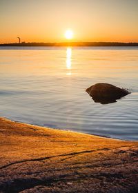 Scenic view of calm sea at sunset