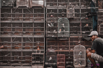 People working in cage of building
