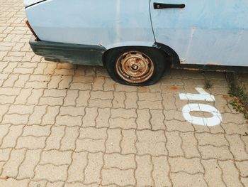 High angle view of vintage car with flat tire