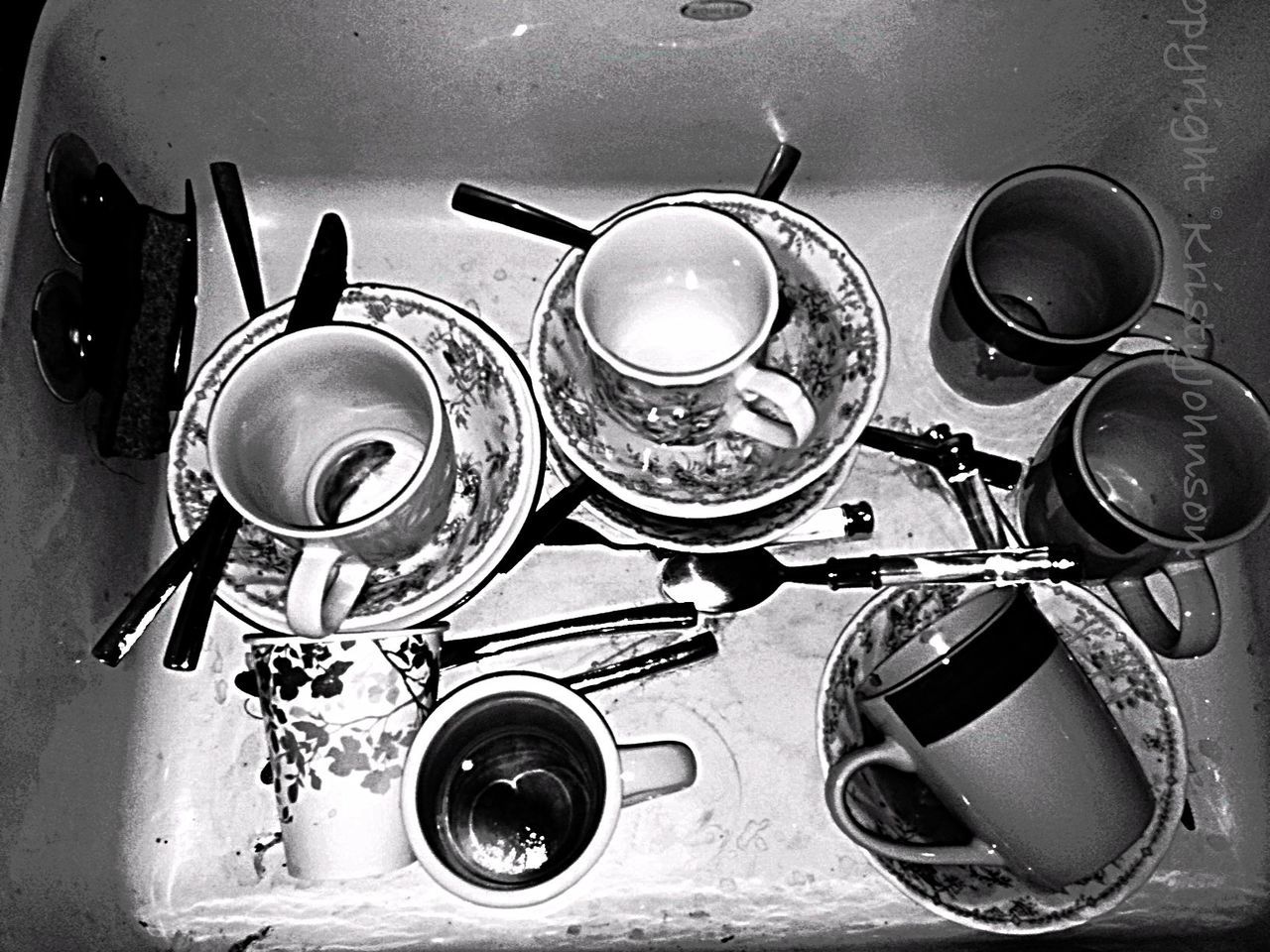indoors, still life, table, food and drink, high angle view, drink, coffee cup, spoon, kitchen utensil, cup, container, plate, no people, refreshment, directly above, close-up, domestic kitchen, freshness, fork, saucer