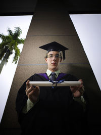 Portrait of young man using mobile phone