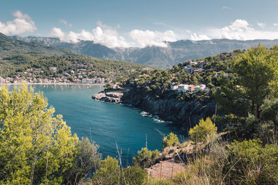 Scenic view of lake against cloudy sky