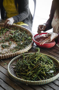 High angle view of man preparing food on table