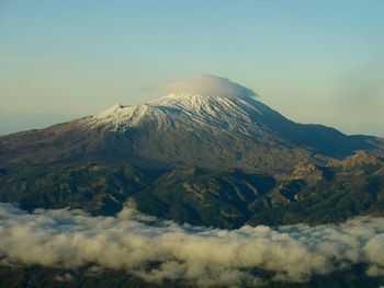 Scenic view of volcanic mountain against sky