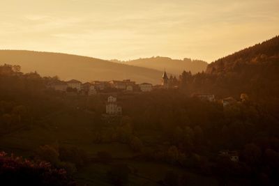 Scenic view of village landscape against sky