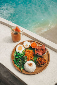 High angle view of food served in swimming pool