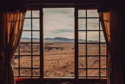 Scenic view of sea seen through window