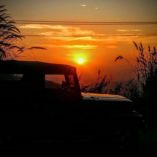 sunset, sun, silhouette, orange color, sky, transportation, scenics, mode of transport, beauty in nature, nature, tranquility, tranquil scene, tree, cloud - sky, car, reflection, water, idyllic, sunlight, land vehicle