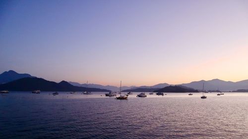 Scenic view of sea against clear sky during sunset