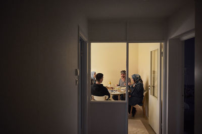 Family eating dinner together at home