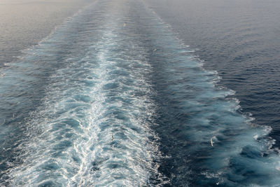 High angle view of water flowing in sea