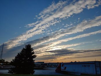 Scenic view of trees against sky during sunset