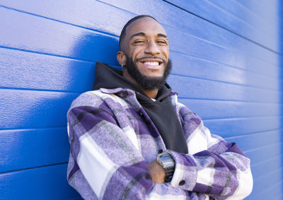 Portrait of young man standing outdoors