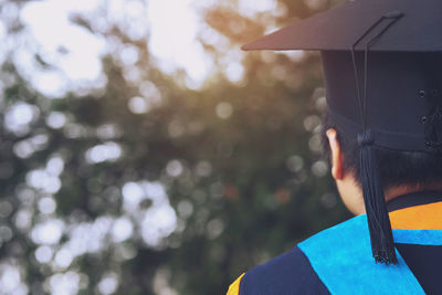 Rear view of man wearing mortarboard