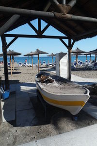 Boats moored on beach