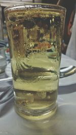 Close-up of ice tea in glass on table