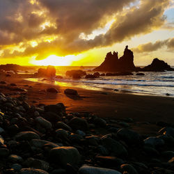 Scenic view of sea against sky during sunset