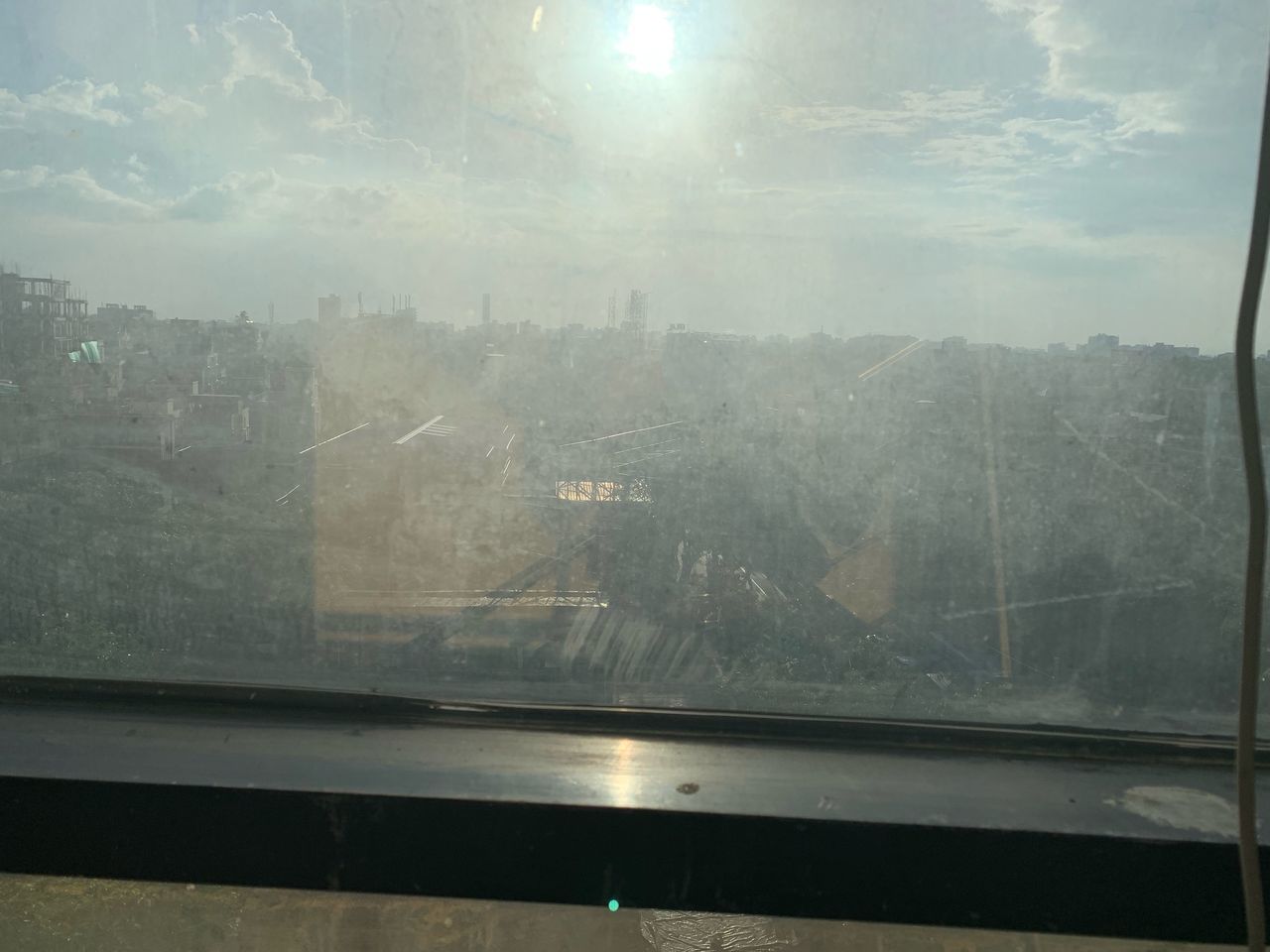 VIEW OF CITY THROUGH WINDOW