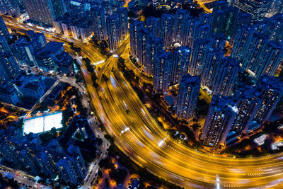 High angle view of city lit up at night