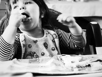 Portrait of a girl sitting on table