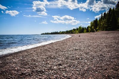 Scenic view of beach against sky