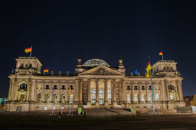 Low angle view of illuminated building at night