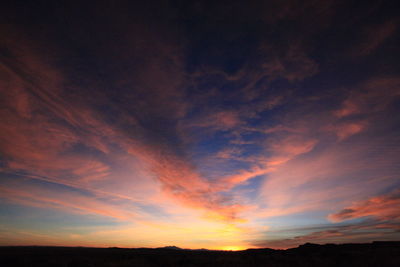 Scenic view of silhouette landscape against sky during sunset