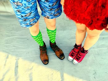 Low section of women wearing shoes