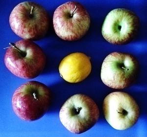 High angle view of apples on blue background