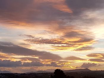 Scenic view of dramatic sky during sunset