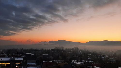 High angle view of townscape against sky during sunset