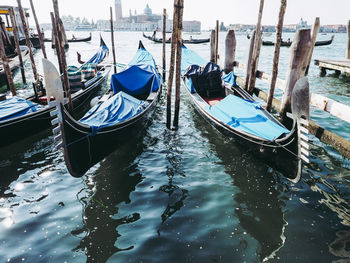 Boats moored in canal