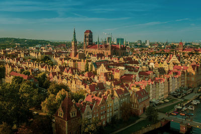 High angle view of trees and buildings against sky