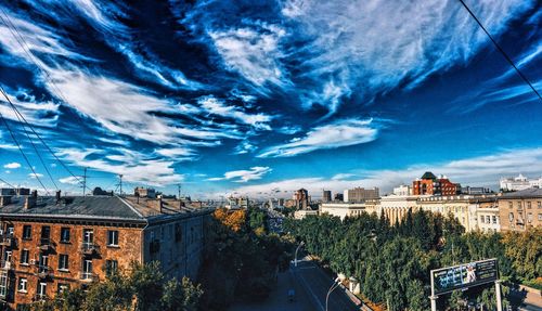 High section of buildings against blue sky