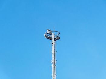 Low angle view of lighting equipment against clear sky