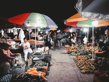 Group of people at market stall