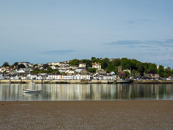 City by sea against sky