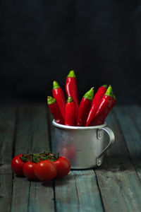 Close-up of red chili peppers on table