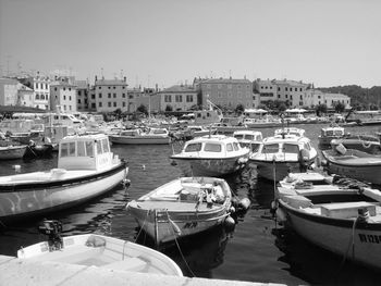 Boats moored at harbor