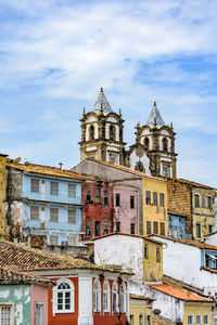 Historic church tower between the roofs and facades of houses in pelourinho in salvador bahia