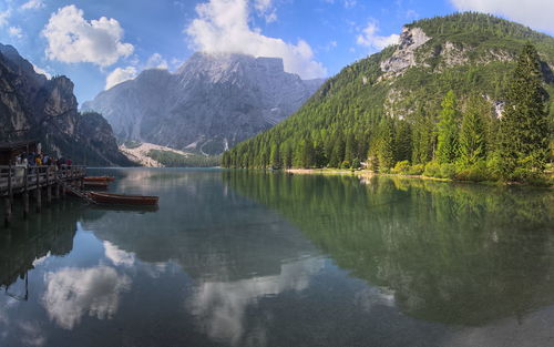 Scenic view of lake and mountains against sky