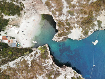 High angle view of rocks by sea