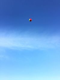 Low angle view of balloons against sky