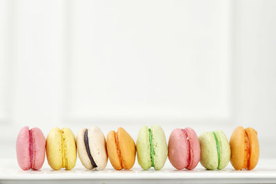 Creative layout made of colorful macaroons on the white background. flat lay. food concept.